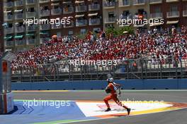 26.06.2011 Valencia, Spain,  A marshall clears the track - Formula 1 World Championship, Rd 08, European Grand Prix, Sunday Race