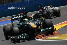 26.06.2011 Valencia, Spain,  Heikki Kovalainen (FIN), Team Lotus leads Jarno Trulli (ITA), Team Lotus - Formula 1 World Championship, Rd 08, European Grand Prix, Sunday Race