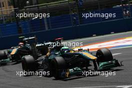 26.06.2011 Valencia, Spain,  Heikki Kovalainen (FIN), Team Lotus leads Jarno Trulli (ITA), Team Lotus - Formula 1 World Championship, Rd 08, European Grand Prix, Sunday Race