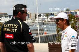23.06.2011 Valencia, Spain,  Eric Boullier (FRA), Team Principal, Lotus Renault GP, Kamui Kobayashi (JAP), Sauber F1 Team - Formula 1 World Championship, Rd 08, European Grand Prix, Thursday