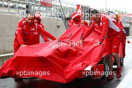 08.07.2011 Silverstone, UK, England,  Ferrari Mechanics pushing the car down to Parc Ferme - Formula 1 World Championship, Rd 09, British Grand Prix, Friday Practice