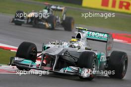 08.07.2011 Silverstone, UK, England,  Nico Rosberg (GER), Mercedes GP Petronas F1 Team leads Heikki Kovalainen (FIN), Team Lotus - Formula 1 World Championship, Rd 09, British Grand Prix, Friday Practice