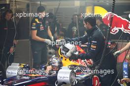 08.07.2011 Silverstone, UK, England,  Sebastian Vettel (GER), Red Bull Racing in a smokey garage - Formula 1 World Championship, Rd 09, British Grand Prix, Friday Practice