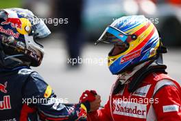 10.07.2011 Silverstone, UK, England,  Sebastian Vettel (GER), Red Bull Racing and 1st place Fernando Alonso (ESP), Scuderia Ferrari - Formula 1 World Championship, Rd 09, British Grand Prix, Sunday Podium