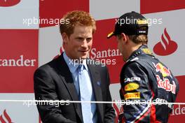 10.07.2011 Silverstone, UK, England,  Prince Harry with Sebastian Vettel (GER), Red Bull Racing - Formula 1 World Championship, Rd 09, British Grand Prix, Sunday Podium