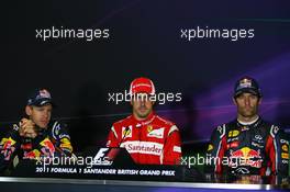 10.07.2011 Silverstone, UK, England,  Sebastian Vettel (GER), Red Bull Racing with Fernando Alonso (ESP), Scuderia Ferrari and Mark Webber (AUS), Red Bull Racing - Formula 1 World Championship, Rd 09, British Grand Prix, Sunday Podium
