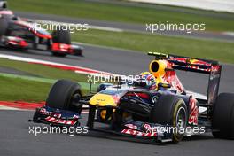 10.07.2011 Silverstone, UK, England,  Mark Webber (AUS), Red Bull Racing leads Jenson Button (GBR), McLaren Mercedes - Formula 1 World Championship, Rd 09, British Grand Prix, Sunday Race