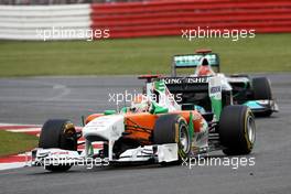 10.07.2011 Silverstone, UK, England,  Adrian Sutil (GER), Force India F1 Team leads Michael Schumacher (GER), Mercedes GP Petronas F1 Team, MGP W02 - Formula 1 World Championship, Rd 09, British Grand Prix, Sunday Race