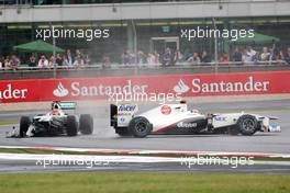 10.07.2011 Silverstone, UK, England,  Michael Schumacher (GER), Mercedes GP Petronas F1 Team crashes with Kamui Kobayashi (JAP), Sauber F1 Team  - Formula 1 World Championship, Rd 09, British Grand Prix, Sunday Race