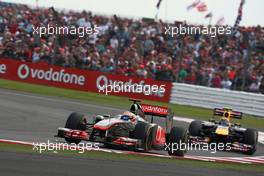 10.07.2011 Silverstone, UK, England,  Lewis Hamilton (GBR), McLaren Mercedes leads Mark Webber (AUS), Red Bull Racing - Formula 1 World Championship, Rd 09, British Grand Prix, Sunday Race