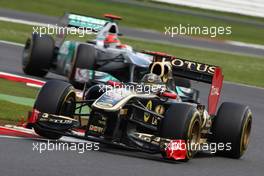 10.07.2011 Silverstone, UK, England,  Nick Heidfeld (GER), Lotus Renault GP leads Michael Schumacher (GER), Mercedes GP Petronas F1 Team - Formula 1 World Championship, Rd 09, British Grand Prix, Sunday Race