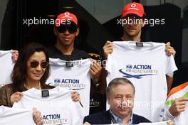 10.07.2011 Silverstone, UK, England,  Michelle Yeoh (MLY), ex. James Bond girl, actor, Girlfriend of Jean Todt, Jean Todt (FRA), FIA president, Lewis Hamilton (GBR), McLaren Mercedes, Jenson Button (GBR), McLaren Mercedes - Formula 1 World Championship, Rd 09, British Grand Prix, Sunday