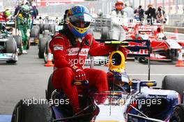 24.07.2011 Nurburgring, Germany,  Fernando Alonso (ESP), Scuderia Ferrari has a lift back to the parc ferme with Mark Webber (AUS), Red Bull Racing - Formula 1 World Championship, Rd 10, German Grand Prix, Sunday Podium