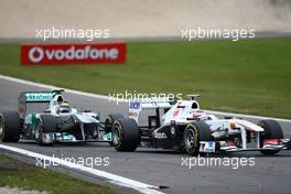 24.07.2011 Nurburgring, Germany,  Nico Rosberg (GER), Mercedes GP Petronas F1 Team and Kamui Kobayashi (JAP), Sauber F1 Team - Formula 1 World Championship, Rd 10, German Grand Prix, Sunday Race