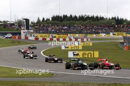 24.07.2011 Nurburgring, Germany,  Heikki Kovalainen (FIN), Team Lotus, Timo Glock (GER), Marussia Virgin Racing - Formula 1 World Championship, Rd 10, German Grand Prix, Sunday Race