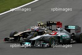 24.07.2011 Nurburgring, Germany, Michael Schumacher (GER), Mercedes GP and Vitaly Petrov (RUS), Lotus Renalut F1 Team  - Formula 1 World Championship, Rd 10, German Grand Prix, Sunday Race