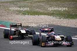 24.07.2011 Nurburgring, Germany,  Sébastien Buemi (SUI), Scuderia Toro Rosso leads Nick Heidfeld (GER), Lotus Renault GP - Formula 1 World Championship, Rd 10, German Grand Prix, Sunday Race