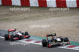 24.07.2011 Nurburgring, Germany,  Vitaly Petrov (RUS), Lotus Renault GP leads Jenson Button (GBR), McLaren Mercedes - Formula 1 World Championship, Rd 10, German Grand Prix, Sunday Race