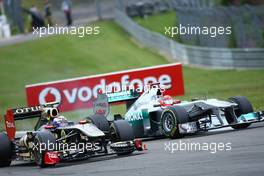 24.07.2011 Nurburgring, Germany,  Vitaly Petrov (RUS), Lotus Renault GP and Michael Schumacher (GER), Mercedes GP Petronas F1 Team - Formula 1 World Championship, Rd 10, German Grand Prix, Sunday Race