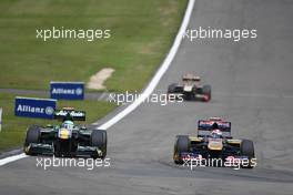 24.07.2011 Nurburgring, Germany,  Heikki Kovalainen (FIN), Team Lotus and Sébastien Buemi (SUI), Scuderia Toro Rosso - Formula 1 World Championship, Rd 10, German Grand Prix, Sunday Race