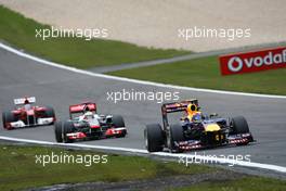 24.07.2011 Nurburgring, Germany,  Mark Webber (AUS), Red Bull Racing leads Lewis Hamilton (GBR), McLaren Mercedes and Fernando Alonso (ESP), Scuderia Ferrari - Formula 1 World Championship, Rd 10, German Grand Prix, Sunday Race