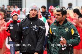 24.07.2011 Nurburgring, Germany,  Daniel Ricciardo (AUS) HRT Formula One Team, Karun Chandhok (IND), test driver, Lotus F1 Team- Formula 1 World Championship, Rd 10, German Grand Prix, Sunday