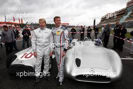 24.07.2011 Nurburgring, Germany,  Mika Hakinen (FIN) drives the Mercedes GP drives the 1955 Mercedes W196 and David Coulthard (GBR), Red Bull Racing, Consultant drives the Mercedes 1955 - Formula 1 World Championship, Rd 10, German Grand Prix, Sunday