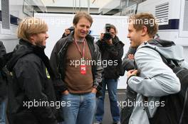 21.07.2011 , Germany,  Nick Heidfeld (GER), Lotus Renault GP and Sebastian Vettel (GER), Red Bull Racing - Formula 1 World Championship, Rd 10, German Grand Prix, Thursday