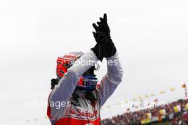 31.07.2011 Budapest, Hungary,  Jenson Button (GBR), McLaren Mercedes celebrates his win in Parc Ferme - Formula 1 World Championship, Rd 11, Hungarian Grand Prix, Sunday Podium