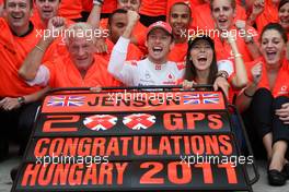 31.07.2011 Budapest, Hungary,  John Button (GBR) Father of Jenson, Nicholas Hamilton (GBR), Brother of Lewis Hamilton, McLaren Mercedes, Lewis Hamilton (GBR), McLaren Mercedes, Jenson Button (GBR), McLaren Mercedes, Jessica Michibata (JPN) girlfriend of Jenson Button (GBR) celebrate with the team - Formula 1 World Championship, Rd 11, Hungarian Grand Prix, Sunday Podium