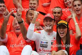 31.07.2011 Budapest, Hungary,  John Button (GBR) Father of Jenson, Nicholas Hamilton (GBR), Brother of Lewis Hamilton, McLaren Mercedes, Lewis Hamilton (GBR), McLaren Mercedes, Jenson Button (GBR), McLaren Mercedes, Jessica Michibata (JPN) girlfriend of Jenson Button (GBR) celebrate with the team - Formula 1 World Championship, Rd 11, Hungarian Grand Prix, Sunday Podium