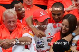 31.07.2011 Budapest, Hungary,  John Button (GBR) Father of Jenson, Nicholas Hamilton (GBR), Brother of Lewis Hamilton, McLaren Mercedes, Lewis Hamilton (GBR), McLaren Mercedes, Jenson Button (GBR), McLaren Mercedes, Jessica Michibata (JPN) girlfriend of Jenson Button (GBR) celebrate with the team - Formula 1 World Championship, Rd 11, Hungarian Grand Prix, Sunday Podium