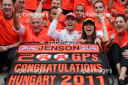 31.07.2011 Budapest, Hungary,  John Button (GBR) Father of Jenson, Nicholas Hamilton (GBR), Brother of Lewis Hamilton, McLaren Mercedes, Lewis Hamilton (GBR), McLaren Mercedes, Jenson Button (GBR), McLaren Mercedes, Jessica Michibata (JPN) girlfriend of Jenson Button (GBR) celebrate with the team - Formula 1 World Championship, Rd 11, Hungarian Grand Prix, Sunday Podium