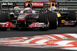 31.07.2011 Budapest, Hungary,  Jenson Button (GBR), McLaren Mercedes leads Sebastian Vettel (GER), Red Bull Racing - Formula 1 World Championship, Rd 11, Hungarian Grand Prix, Sunday Race