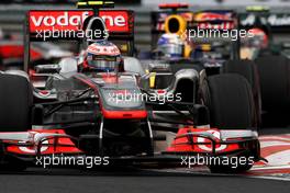 31.07.2011 Budapest, Hungary,  Jenson Button (GBR), McLaren Mercedes leads Sebastian Vettel (GER), Red Bull Racing - Formula 1 World Championship, Rd 11, Hungarian Grand Prix, Sunday Race