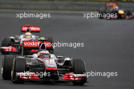 31.07.2011 Budapest, Hungary,  Jenson Button (GBR), McLaren Mercedes leads Lewis Hamilton (GBR), McLaren Mercedes - Formula 1 World Championship, Rd 11, Hungarian Grand Prix, Sunday Race