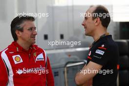 30.07.2011 Budapest, Hungary,  Pat Fry (GBR) Ferrari technical director  with Phil Prew (GBR) McLaren Race Engineer - Formula 1 World Championship, Rd 11, Hungarian Grand Prix, Saturday