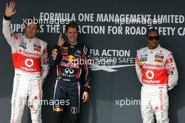 30.07.2011 Budapest, Hungary,  Jenson Button (GBR), McLaren Mercedes, Sebastian Vettel (GER), Red Bull Racing and Lewis Hamilton (GBR), McLaren Mercedes - Formula 1 World Championship, Rd 11, Hungarian Grand Prix, Saturday Qualifying