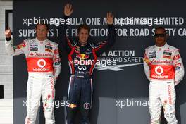 30.07.2011 Budapest, Hungary,  Jenson Button (GBR), McLaren Mercedes with pole man Sebastian Vettel (GER), Red Bull Racing and Lewis Hamilton (GBR), McLaren Mercedes - Formula 1 World Championship, Rd 11, Hungarian Grand Prix, Saturday Qualifying