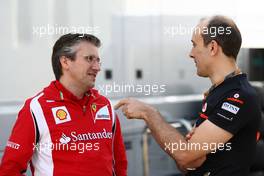 30.07.2011 Budapest, Hungary,  Pat Fry (GBR) Ferrari technical director with Phil Prew (GBR) McLaren Race Engineer - Formula 1 World Championship, Rd 11, Hungarian Grand Prix, Saturday