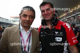 30.10.2011 New Delhi, India, Rowan Atkinson (GBR), British actor (Mr Bean) with Graeme Lowden, Virgin Racing director of racing - Formula 1 World Championship, Rd 17, Indian Grand Prix, Sunday Pre-Race Grid