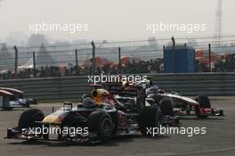 30.10.2011 New Delhi, India, Sebastian Vettel (GER), Red Bull Racing leads Jenson Button (GBR), McLaren Mercedes  - Formula 1 World Championship, Rd 17, Indian Grand Prix, Sunday Race