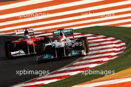 30.10.2011 New Delhi, India, Michael Schumacher (GER), Mercedes GP Petronas F1 Team leads Fernando Alonso (ESP), Scuderia Ferrari - Formula 1 World Championship, Rd 17, Indian Grand Prix, Sunday Race