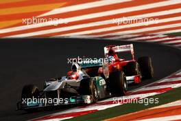 30.10.2011 New Delhi, India, Michael Schumacher (GER), Mercedes GP Petronas F1 Team, Fernando Alonso (ESP), Scuderia Ferrari - Formula 1 World Championship, Rd 17, Indian Grand Prix, Sunday Race