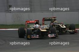 30.10.2011 New Delhi, India,  Sebastien Buemi (SUI), Scuderia Toro Rosso and Bruno Senna (BRE), Renault F1 Team  - Formula 1 World Championship, Rd 17, Indian Grand Prix, Sunday Race