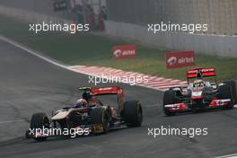 30.10.2011 New Delhi, India,  Jaime Alguersuari (ESP), Scuderia Toro Rosso and Lewis Hamilton (GBR), McLaren Mercedes  - Formula 1 World Championship, Rd 17, Indian Grand Prix, Sunday Race