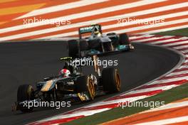 30.10.2011 New Delhi, India, Jarno Trulli (ITA), Team Lotus leads Nico Rosberg (GER), Mercedes GP Petronas F1 Team - Formula 1 World Championship, Rd 17, Indian Grand Prix, Sunday Race