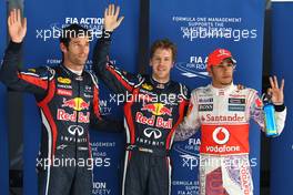 29.10.2011 New Delhi, India, Mark Webber (AUS), Red Bull Racing with pole an Sebastian Vettel (GER), Red Bull Racing and Lewis Hamilton (GBR), McLaren Mercedes  - Formula 1 World Championship, Rd 17, Indian Grand Prix, Saturday Qualifying