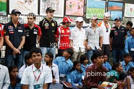 27.10.2011 New Delhi, India, F1 Drivers with young Indians - Formula 1 World Championship, Rd 17, Indian Grand Prix, Thursday