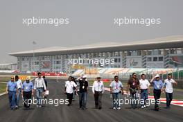 27.10.2011 New Delhi, India, Herbie Blash (GBR), FIA Observer, Charlie Whiting (GBR), FIA Safty delegate, Race director & offical starter walks the track - Formula 1 World Championship, Rd 17, Indian Grand Prix, Thursday